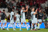 | Photo: AP/Armando Franca : 2024-25 Nations League Football Portugal vs Croatia: Portugal's Ruben Dias, center, and Portugal's Diogo Jota, right, applaud the crowd after the match